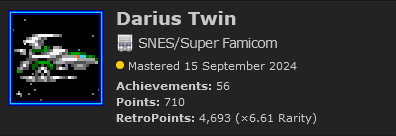 A screenshot of a small part of the RetroAchievements website. On the left is the Silver Hawk from Darius Twin in silver and green, and on the right the text reads as follows: "Darius Twin / SNES/Super Famicom / Mastered 15 September 2024 / Achievements: 56 / Points: 710 / RetroPoints: 4,693 (x6.61 Rarity)"